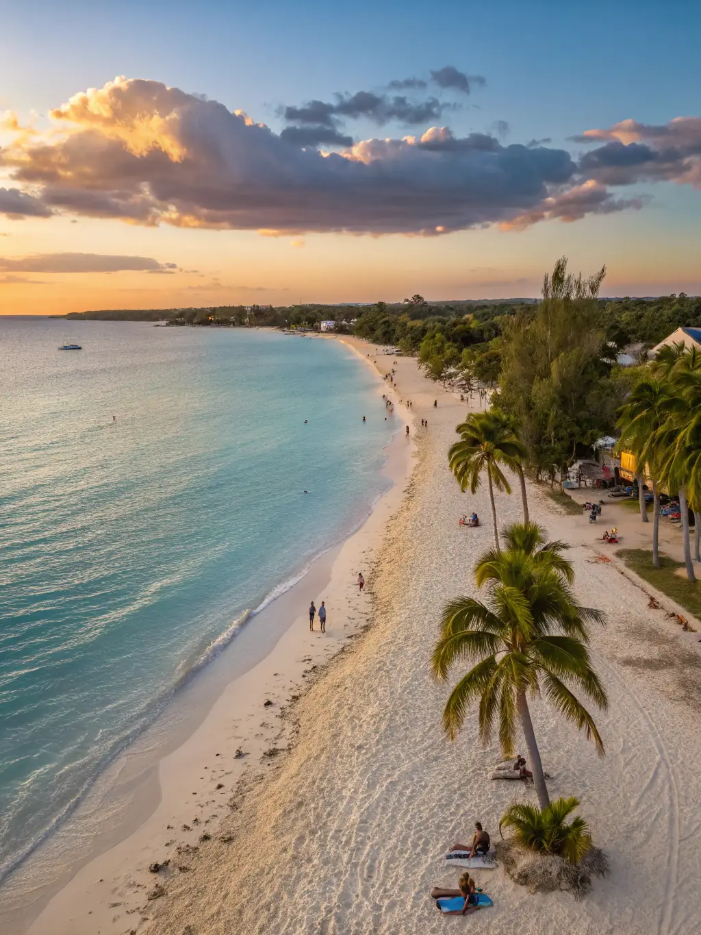 A picturesque scene of Seven Mile Beach in Negril, Jamaica, featuring a long stretch of golden sand, clear blue waters, and palm trees swaying in the breeze.