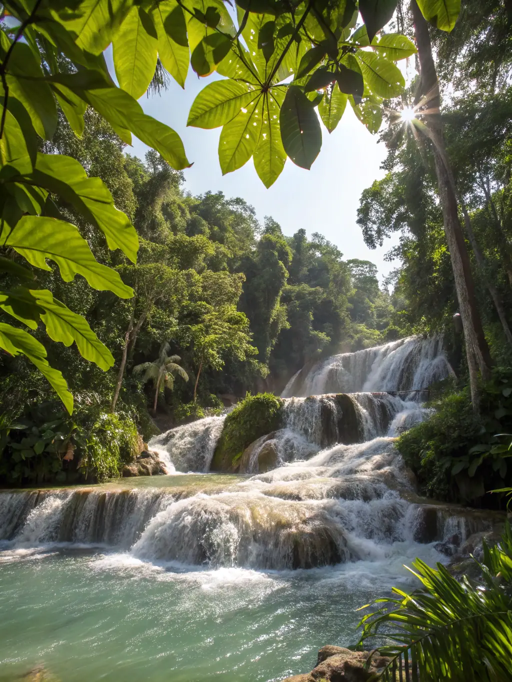A serene image of Dunn's River Falls, with tourists climbing the falls and enjoying the refreshing water, representing a popular Jamaican attraction.